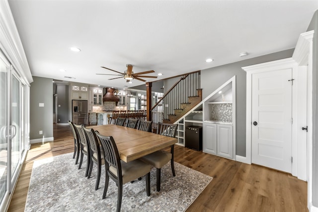 dining room featuring ceiling fan and hardwood / wood-style floors