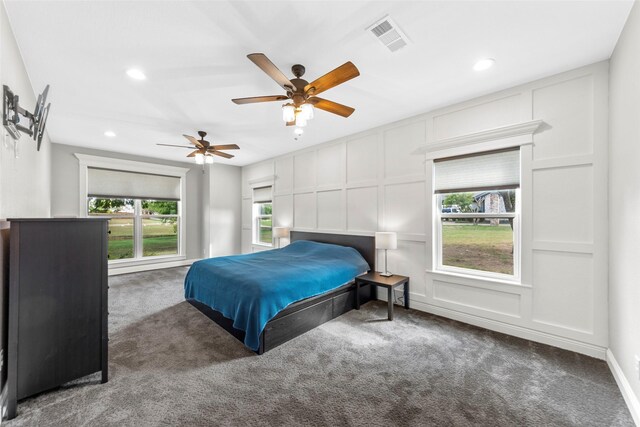 carpeted bedroom featuring ceiling fan