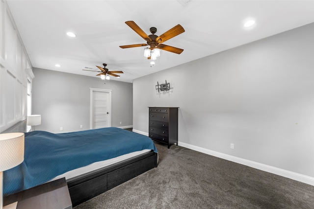 bedroom featuring ceiling fan and dark carpet