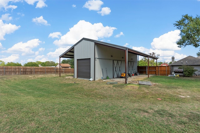 view of outbuilding with a yard