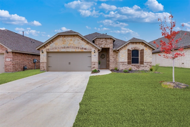 view of front of property with a garage and a front yard