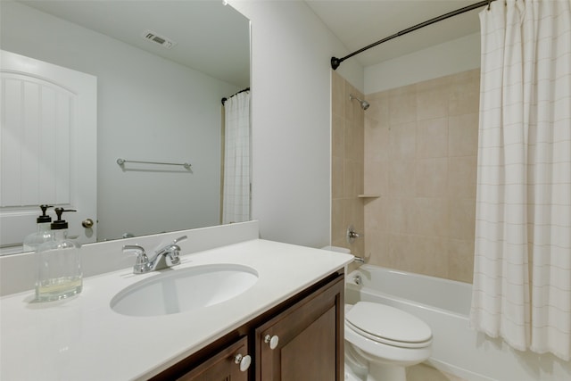 full bathroom with vanity, toilet, and shower / tub combo