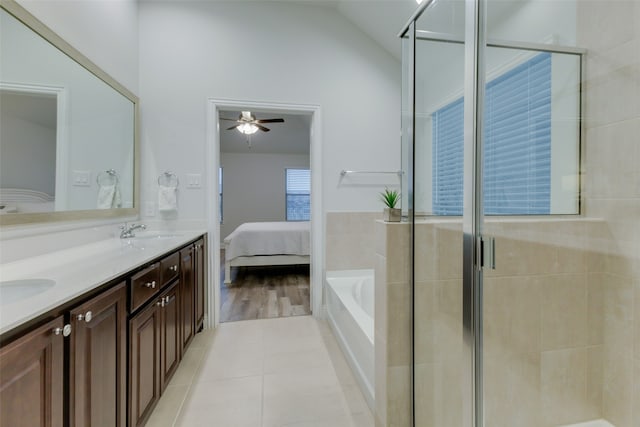 bathroom featuring ceiling fan, separate shower and tub, lofted ceiling, vanity, and hardwood / wood-style flooring