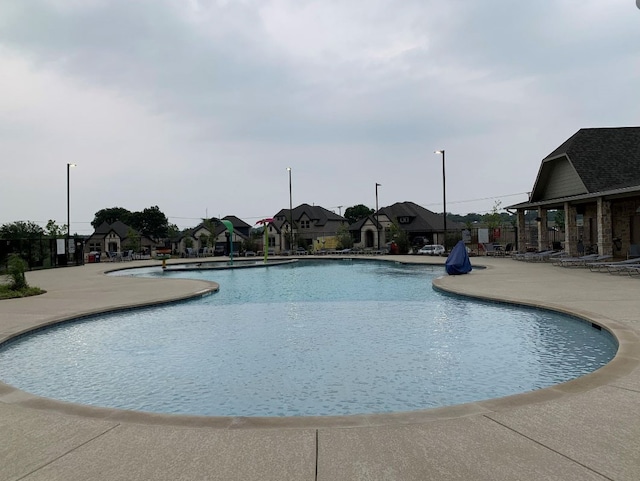 view of pool featuring a patio