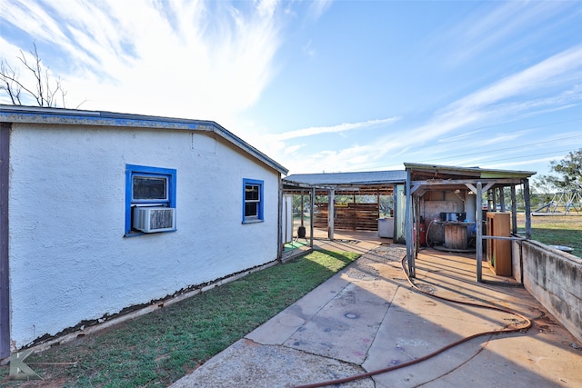 view of side of property featuring a patio