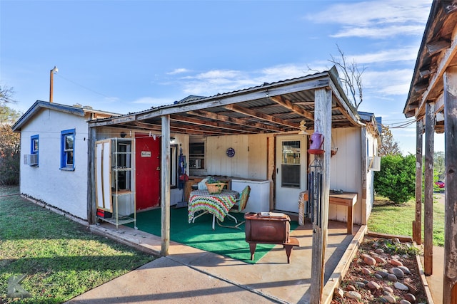 back of property featuring cooling unit