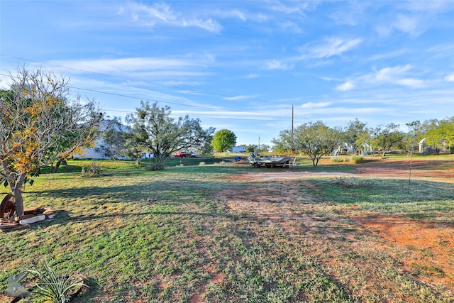 view of yard with a rural view