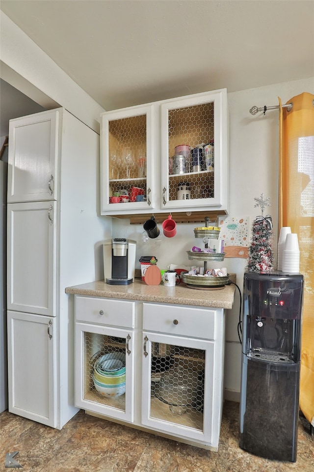 bar featuring white cabinetry