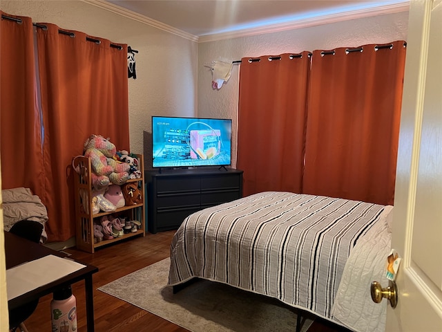 bedroom featuring dark hardwood / wood-style floors and ornamental molding