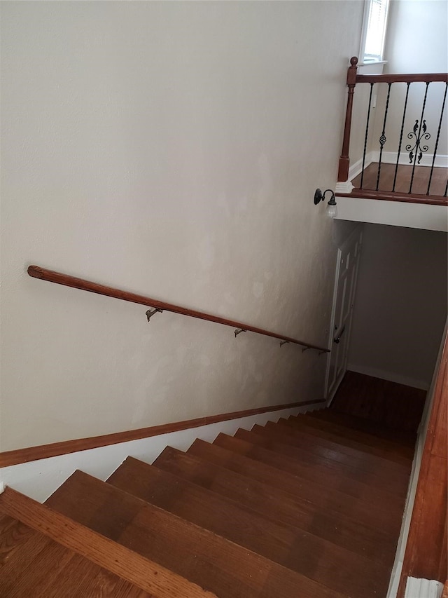 stairs with wood-type flooring