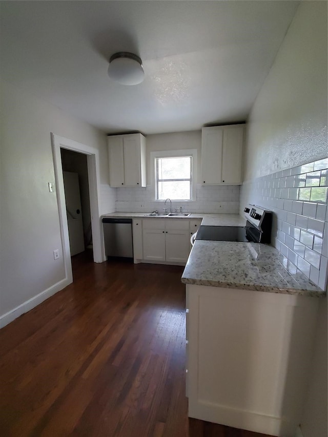 kitchen featuring white cabinets, range, dark wood-type flooring, and dishwasher