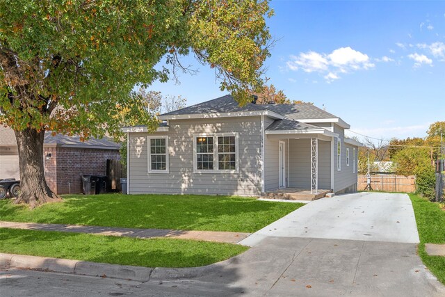 bungalow-style house featuring a front yard