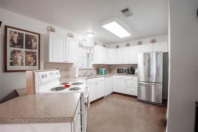 kitchen featuring white cabinetry, sink, and appliances with stainless steel finishes