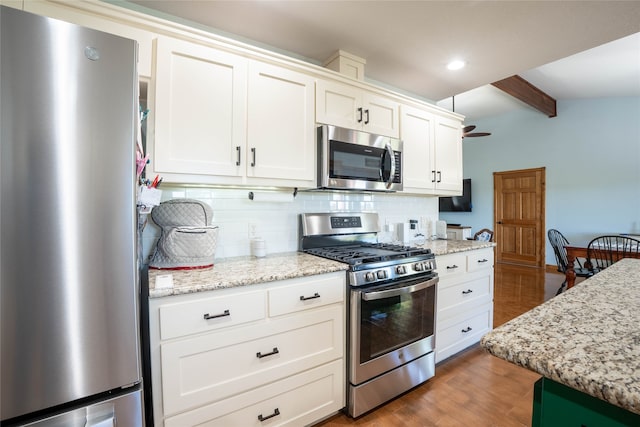 kitchen featuring backsplash, white cabinets, beamed ceiling, dark hardwood / wood-style flooring, and stainless steel appliances