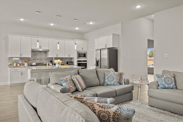 living room with light hardwood / wood-style floors