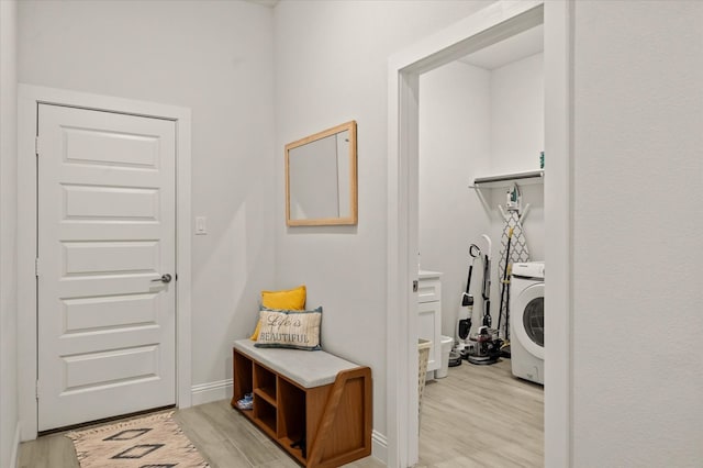 mudroom featuring washer / dryer and light wood-type flooring