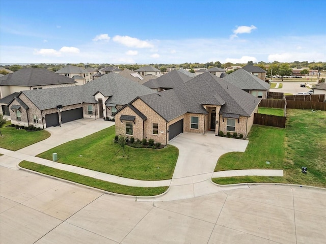 french country home featuring brick siding, driveway, roof with shingles, a residential view, and a front lawn