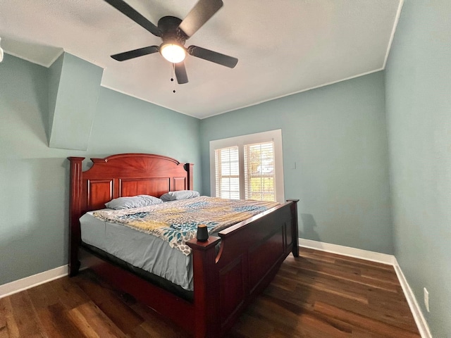 bedroom featuring dark hardwood / wood-style floors, ceiling fan, and ornamental molding