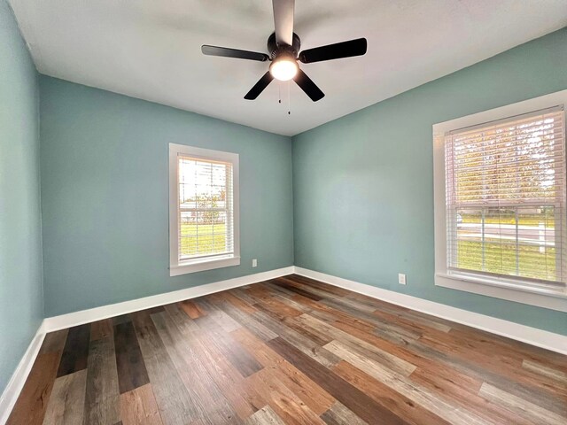 spare room featuring ceiling fan and wood-type flooring