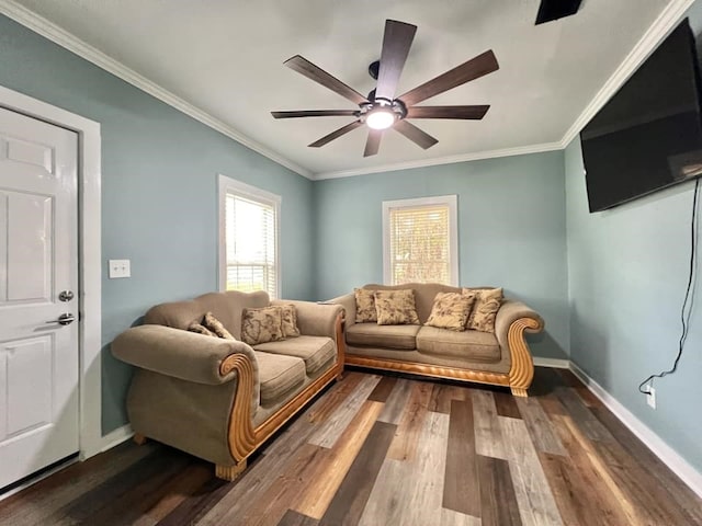 living room featuring dark hardwood / wood-style floors, ceiling fan, and ornamental molding