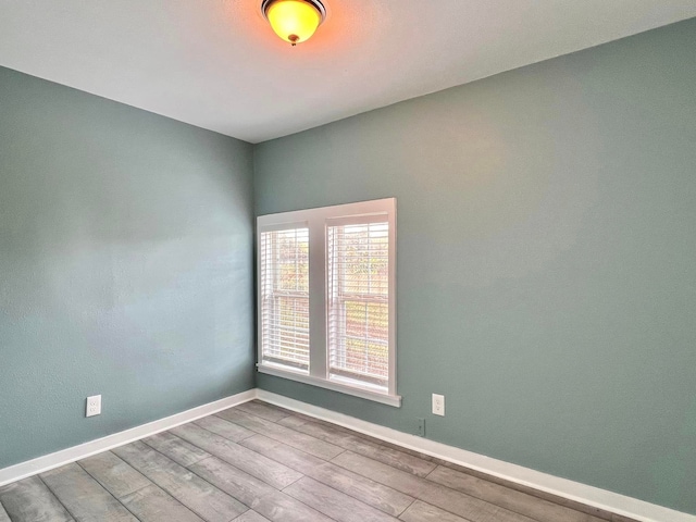 unfurnished room featuring light wood-type flooring