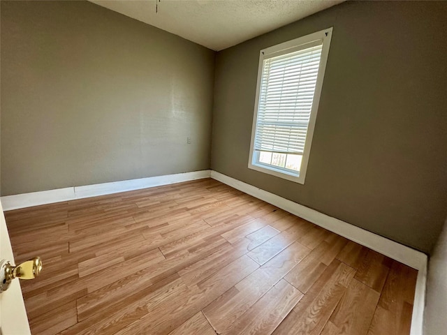 bedroom with wood-type flooring, a textured ceiling, and ceiling fan