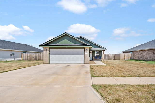 view of front facade featuring a garage and a front lawn