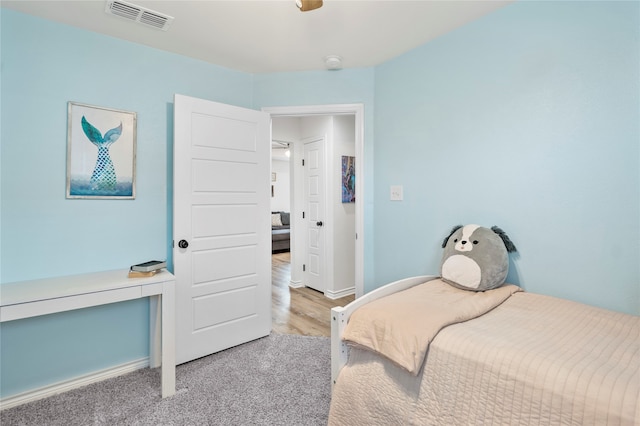 bedroom with light wood-type flooring