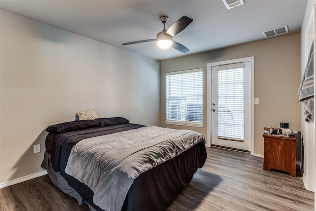 bedroom with ceiling fan, access to exterior, and light hardwood / wood-style flooring