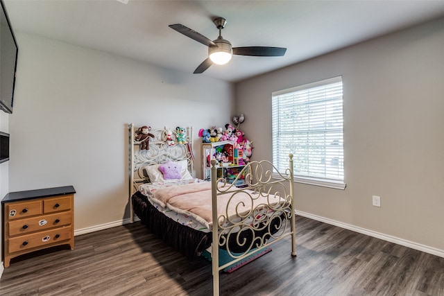 bedroom featuring ceiling fan and dark hardwood / wood-style floors