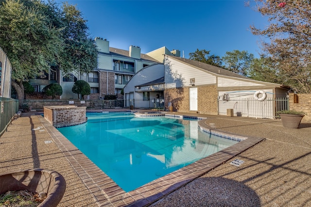 view of swimming pool featuring a patio area