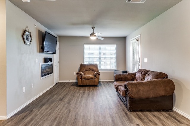 sitting room featuring dark hardwood / wood-style floors and ceiling fan