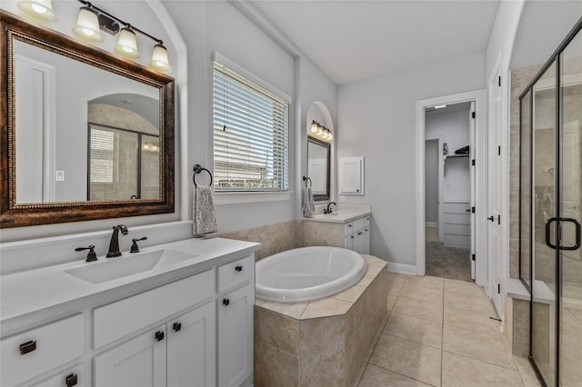 bathroom featuring vanity, tile patterned floors, and separate shower and tub