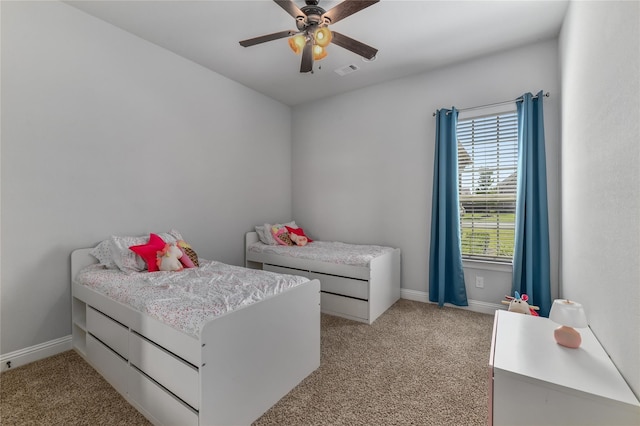 bedroom featuring ceiling fan and light carpet