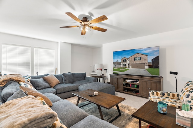 living room featuring ceiling fan and light carpet