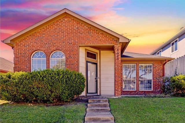 view of front of house with a yard