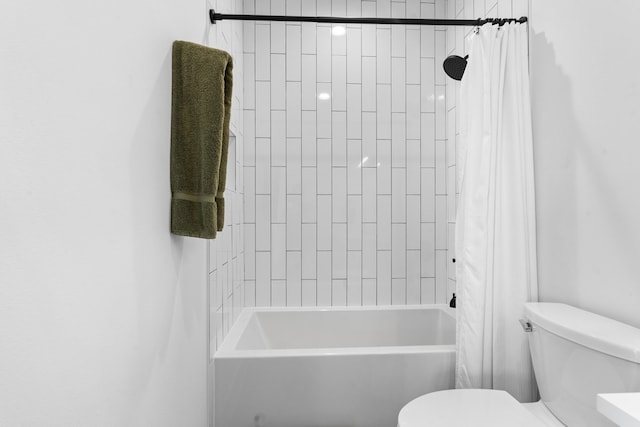 bathroom with toilet and shower / tub combo with curtain