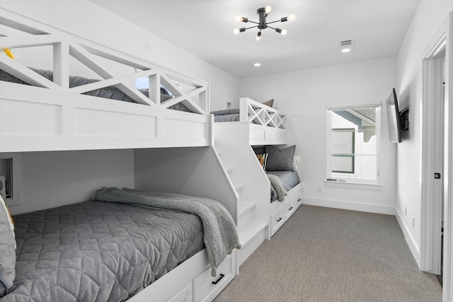 bedroom featuring carpet and a notable chandelier