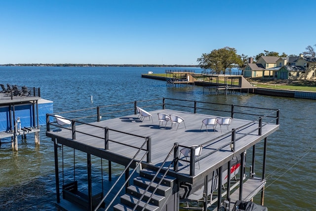 dock area featuring a water view