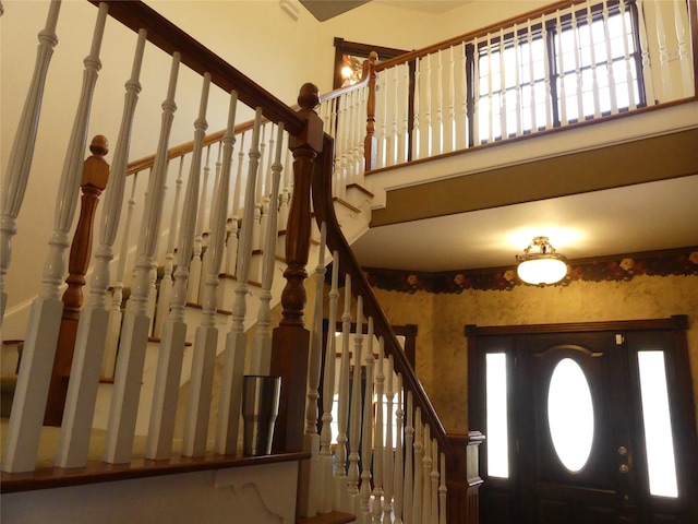 foyer entrance with a high ceiling