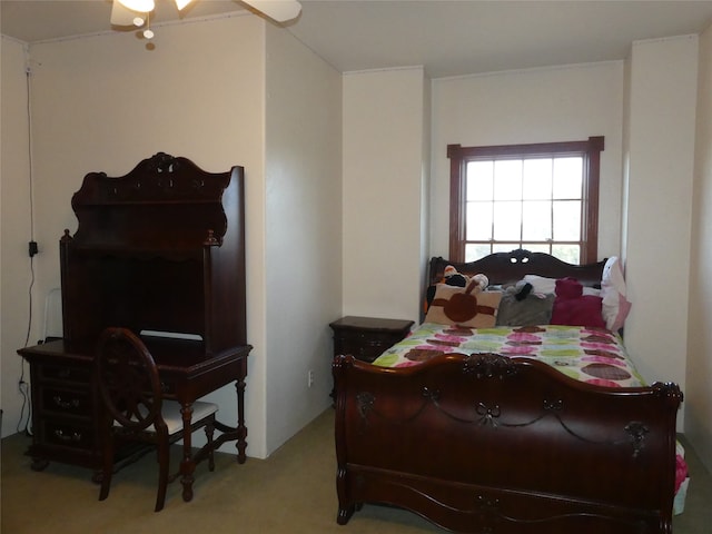 bedroom featuring ceiling fan and light carpet