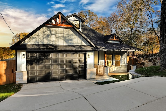 view of front of house with a porch and a garage