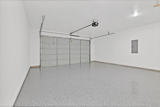 garage featuring electric panel and a garage door opener