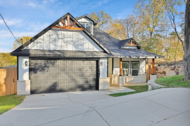 view of front facade featuring a porch and a garage