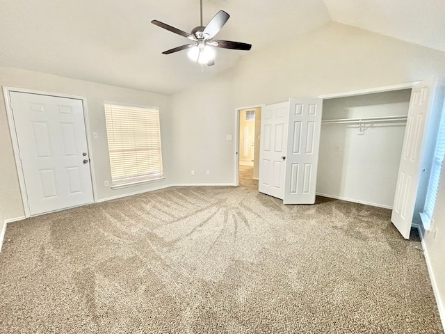 unfurnished bedroom with ceiling fan, carpet floors, and vaulted ceiling