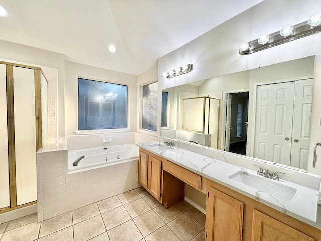 bathroom featuring tile patterned floors, vanity, and plus walk in shower