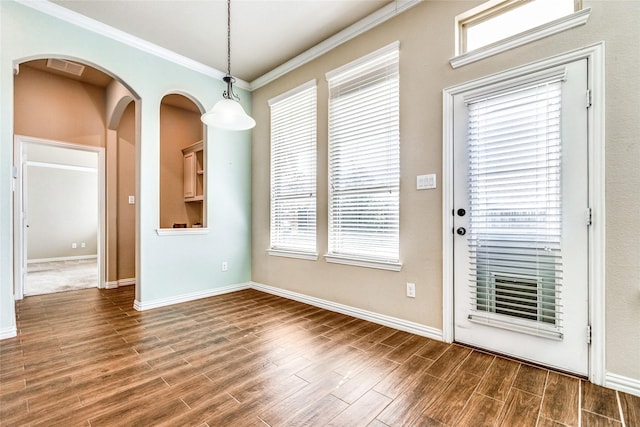 unfurnished dining area featuring ornamental molding