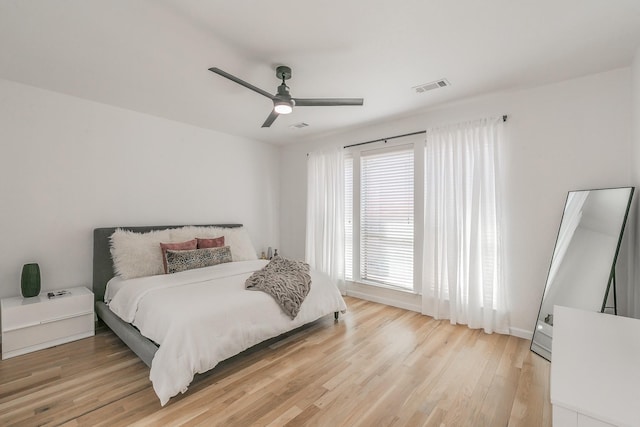 bedroom with wood-type flooring and ceiling fan