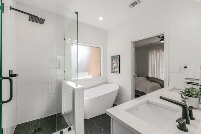 bathroom featuring vanity and separate shower and tub