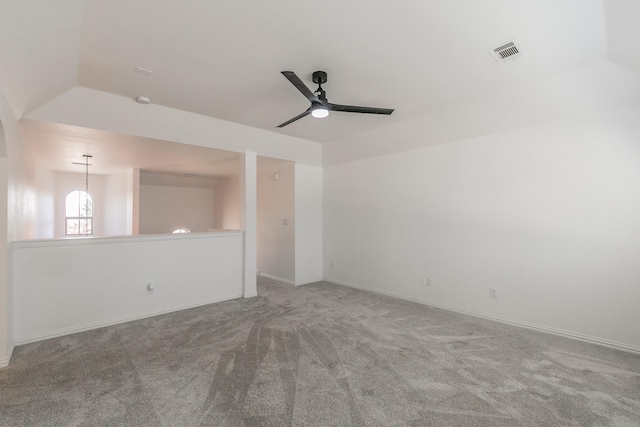 carpeted empty room featuring ceiling fan